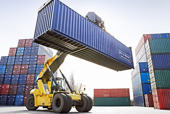 Forklift handling a shipping container